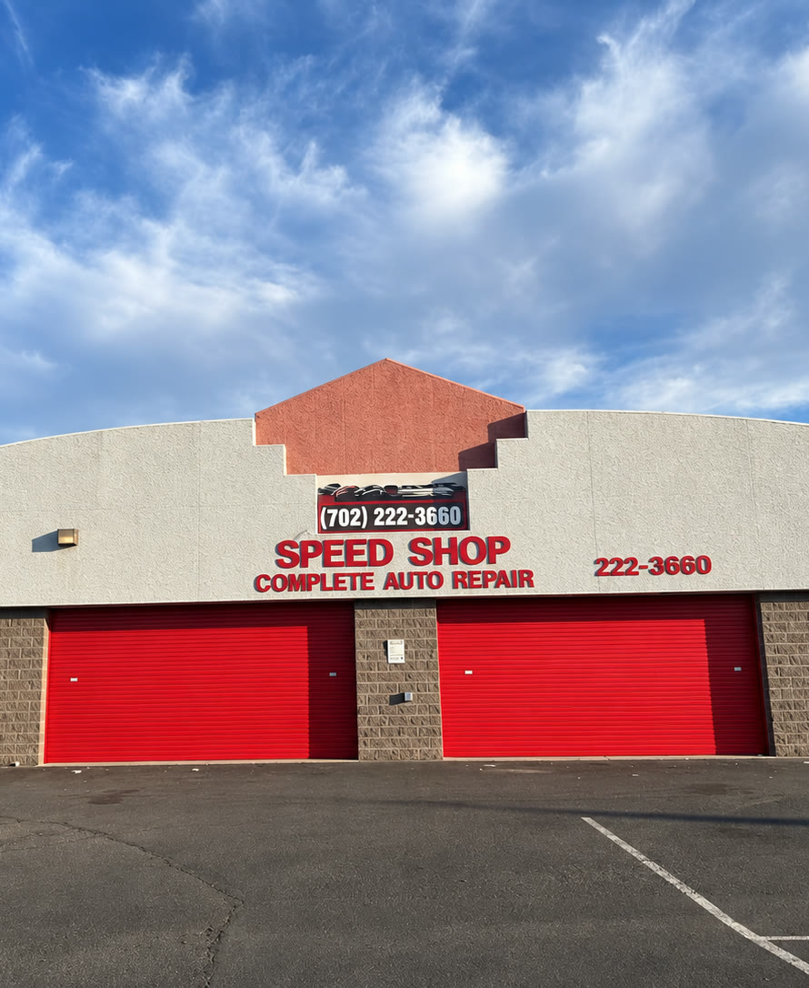 Speed Shop Complete Auto Repair storefront with red bay doors on S Jones Blvd